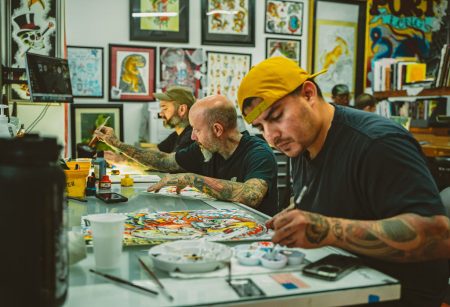 Long Beach Tattoo artist working on custom tattoo designs